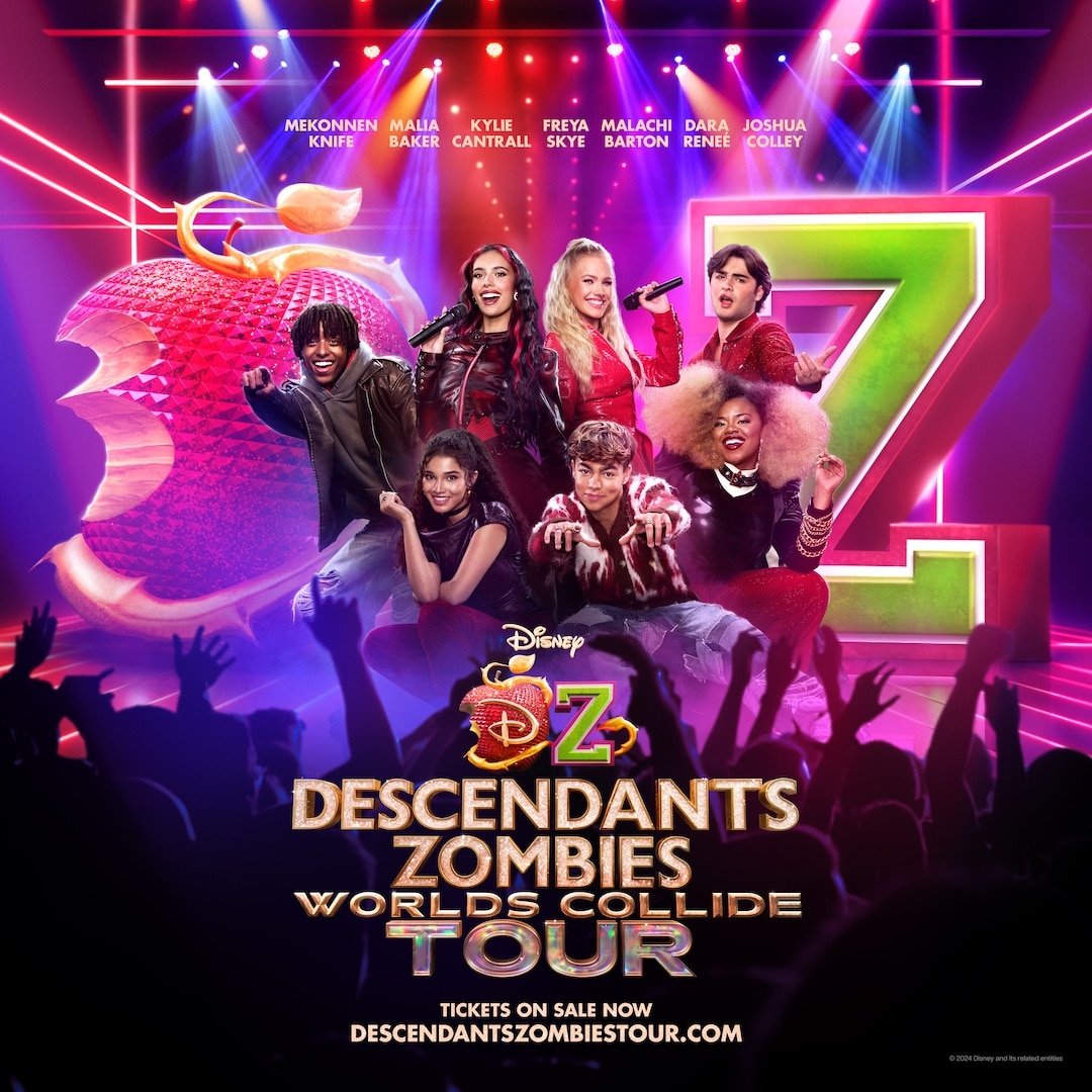 Seven energetic performers in vibrant costumes pose before a large red apple and colorful Z logo, promoting the Descendants & Zombies Worlds Collide Tour. Tour info, website, and details on free tickets are displayed at the bottom.
