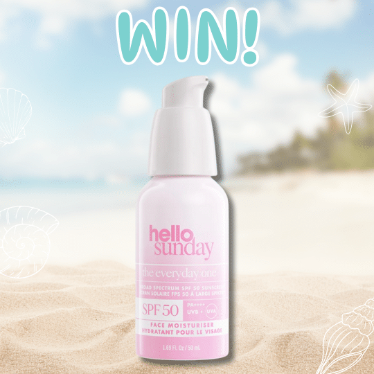 A bottle of Hello Sunday The Everyday One SPF 50 face moisturizer sits on sandy beach with blurred palm trees and ocean behind it. The word WIN! appears in large letters above, inviting you to enjoy the ultimate summer skincare with Hello Sunday.