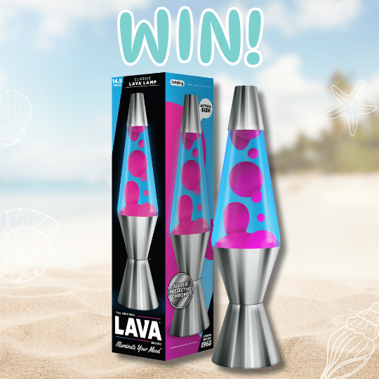 An Original Lava Lamp with pink wax and blue liquid sits next to its box on a sandy beach background. Large text above reads WIN! in bold, playful letters.